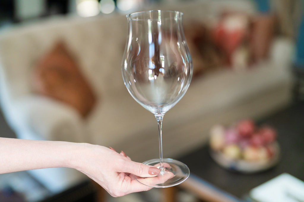 Why is it Important to Hold a Wine Glass by the Stem?