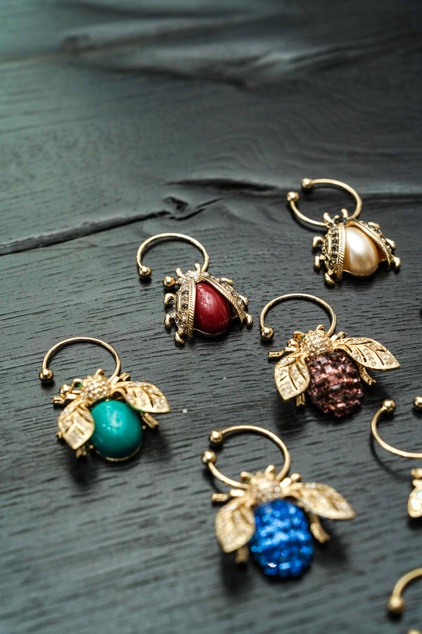 Bedazzled bee wine charms, dark jewel tones